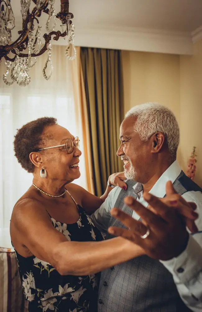 a man and woman dancing and practicing first date etiquette for people over 50