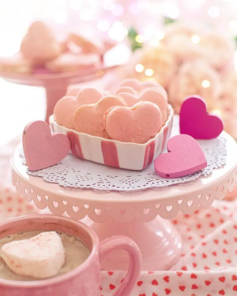 a pink heart shaped cookies on a pink tray