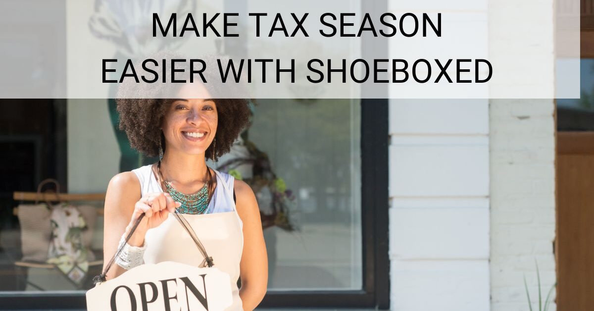 Woman holding a sign under a sign that says make take season easier with shoeboxed