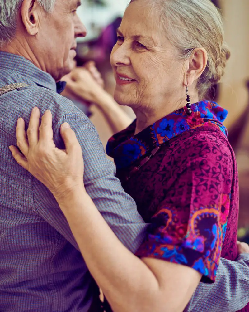 a man and woman ballroom dancing to demonstrate one of many hobbies for men over 60