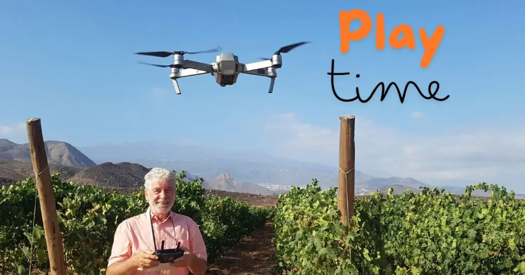 a man holding a remote control in front of a drone demonstrating one of many great hobbies for men over 60