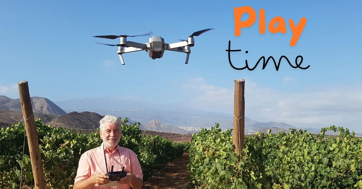 a man holding a remote control in front of a drone demonstrating one of many great hobbies for men over 60