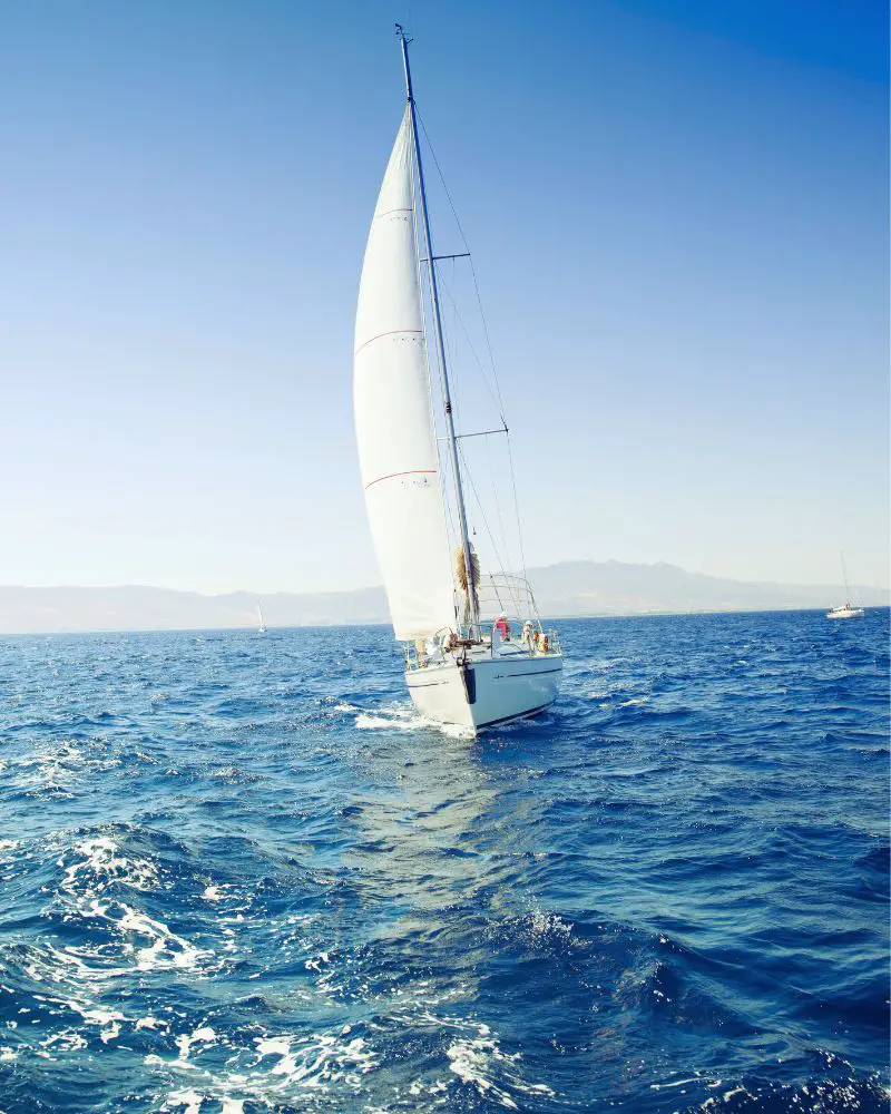 a sailboat in the water demonstrating one of many great hobbies for men over 60