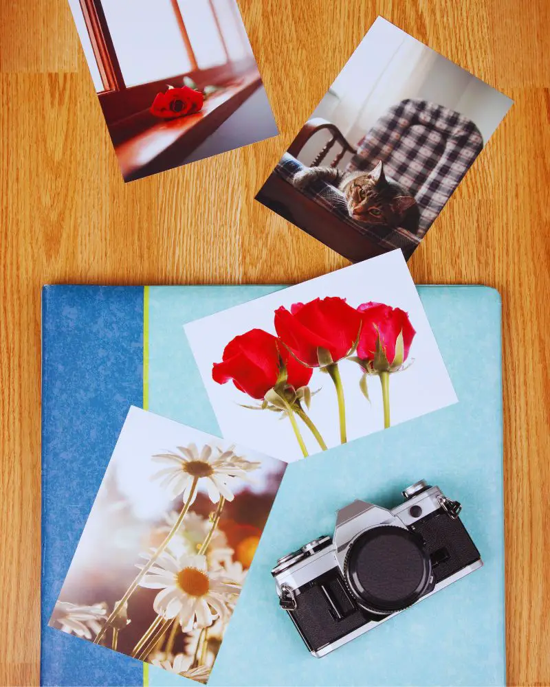 a camera and pictures on a table