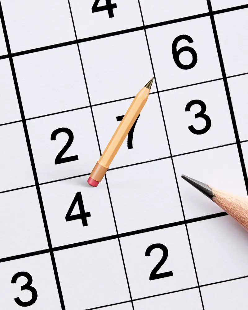 a pencil on a sudoku game to show one of many hobbies for men over 60