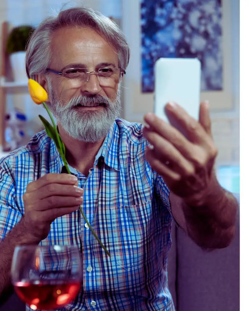 Senior man looking at his mobile phone