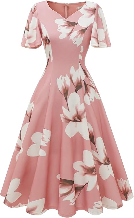 Vintage flare pink dress with large floral print to demonstrate what to wear to a wedding over 50