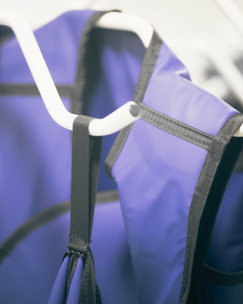 A blue lead apron used when someone is havig an xray to protect them from radiation