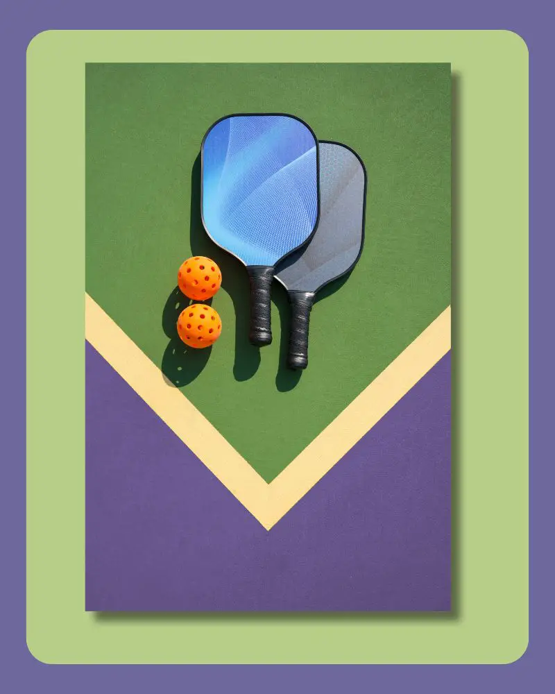 pickleball paddles and balls on a picketball table