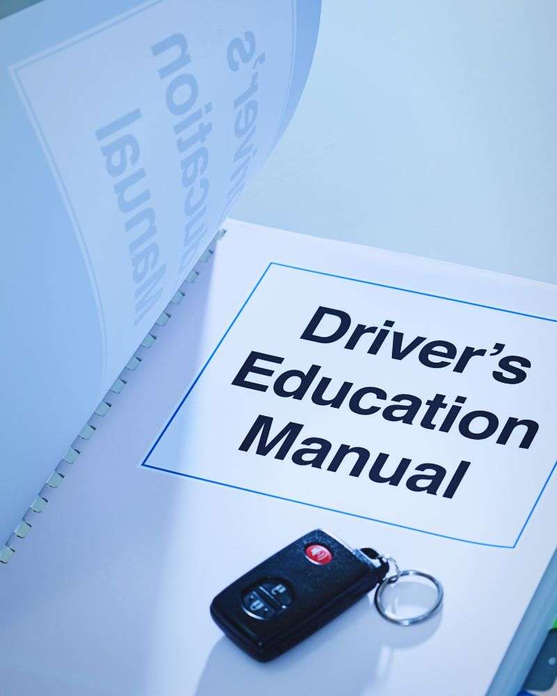 a driver's manual with a key on it for people over 50 and afraid to drive