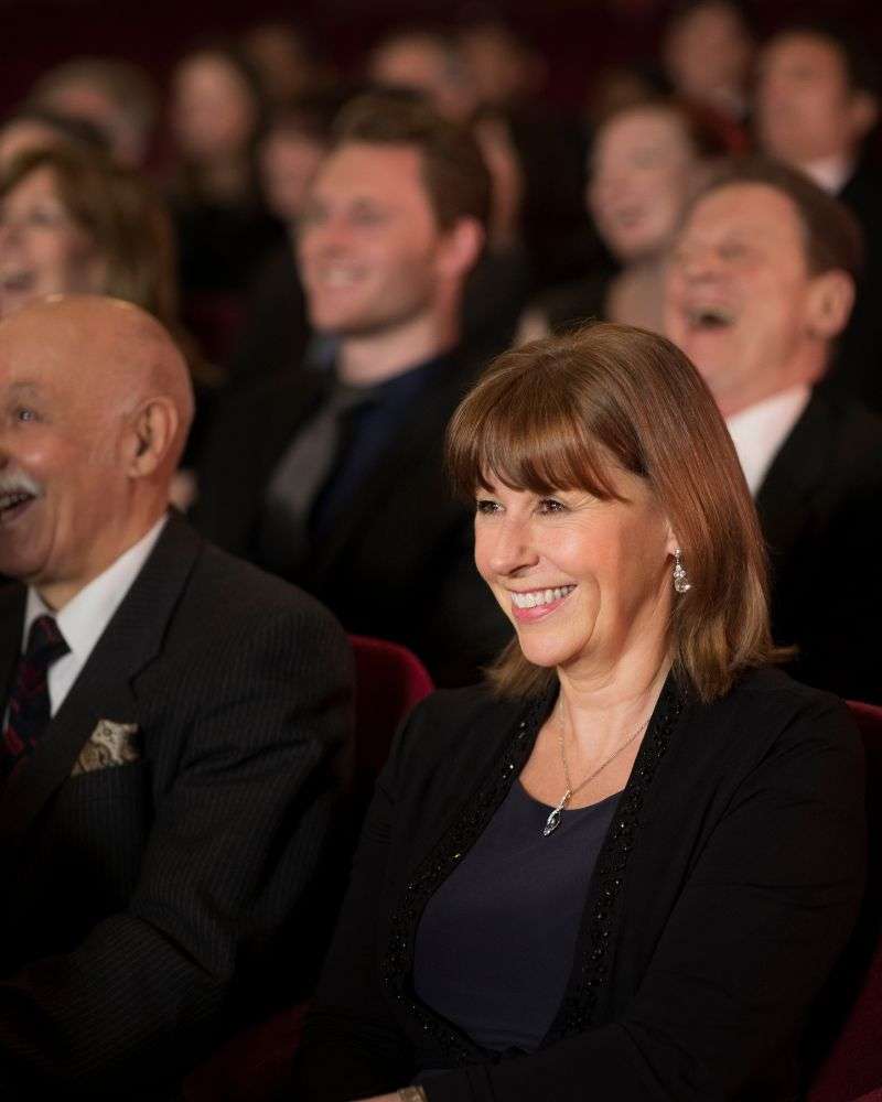 A group of people enjoying a well-written retirement speech