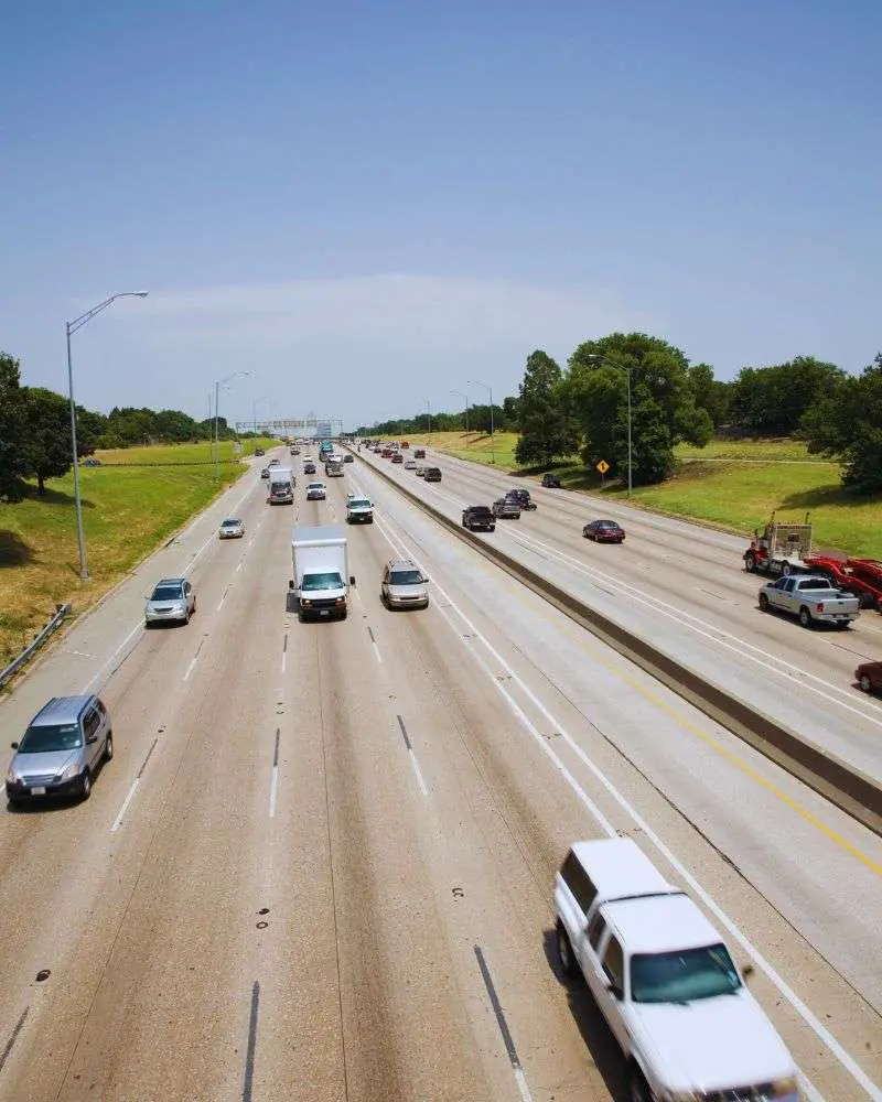 a highway with many cars on it