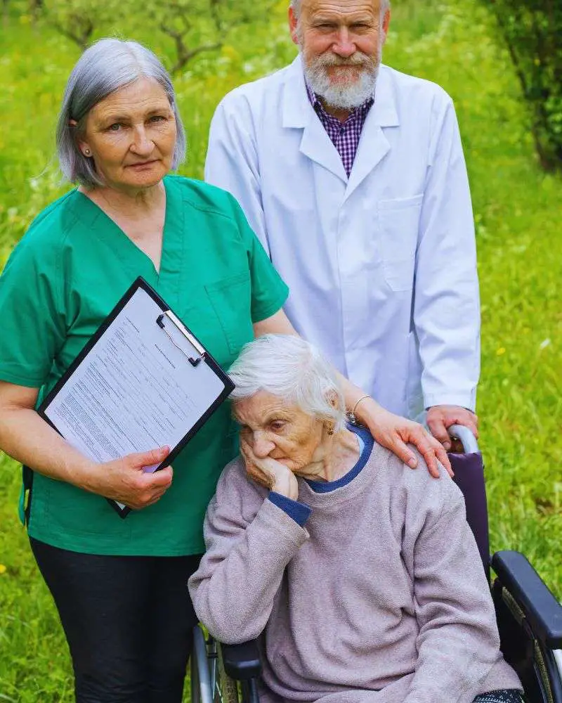 a group of people standing in a grass field