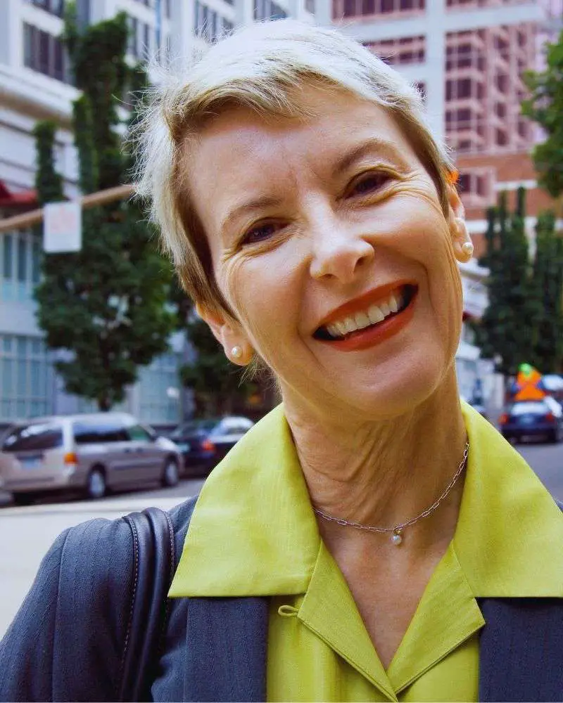 a woman smiling at the camera and representing one of many beauty bloggers over 50.