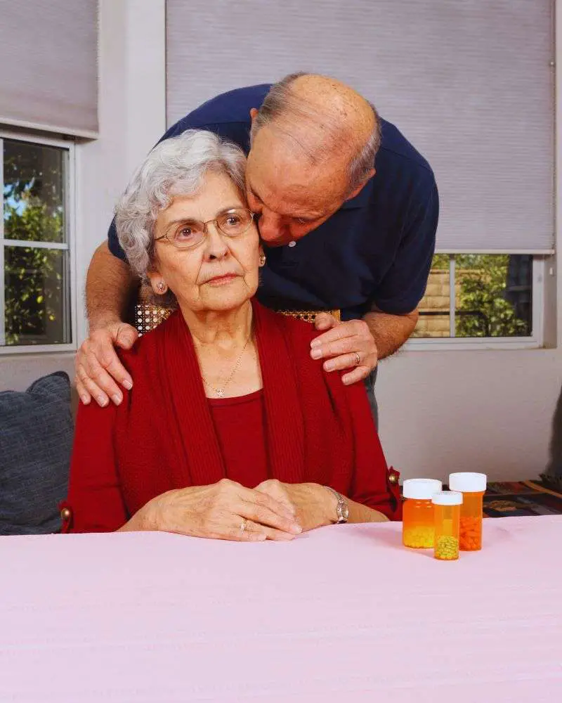 a man holding a woman's head