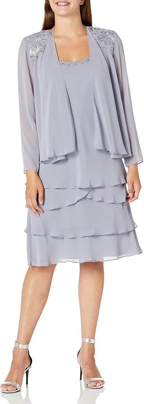 Woman modelling a lavendar cocktail dress to show what to wear to a wedding over 50