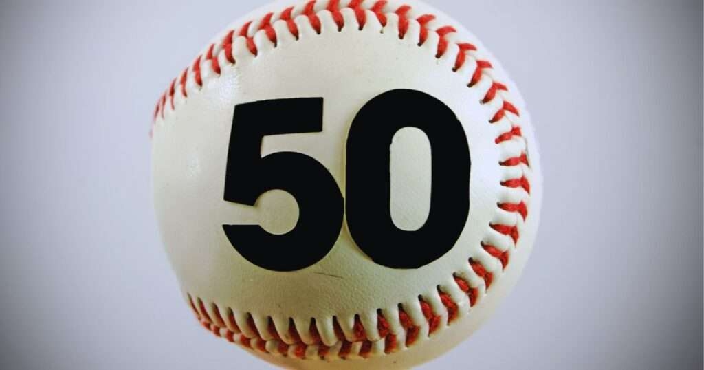 a close up of a baseball with the number 50 on it to represent over 50 baseball leagues