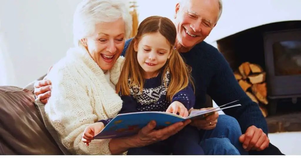 a group of people looking at a book