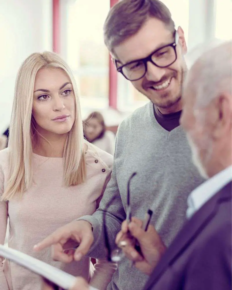 a group of people looking welcoming a man who considered second careers for lawyers over 50