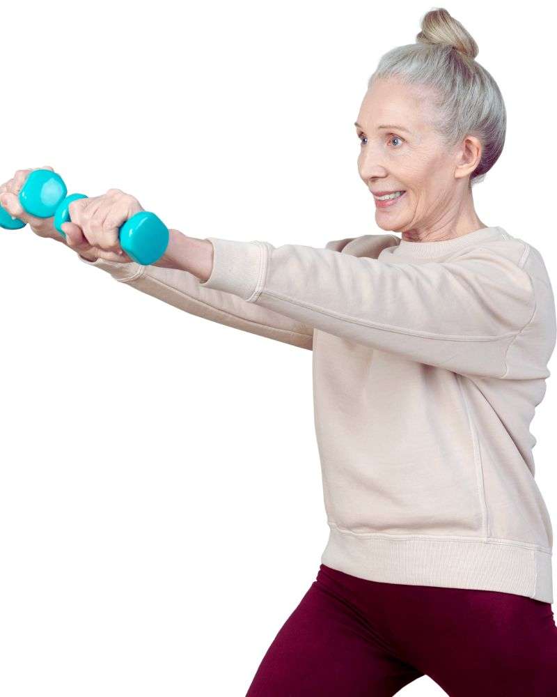 Older woman doing arm raises with weights to demonstrate safe 5x5 workouts for over 50 women