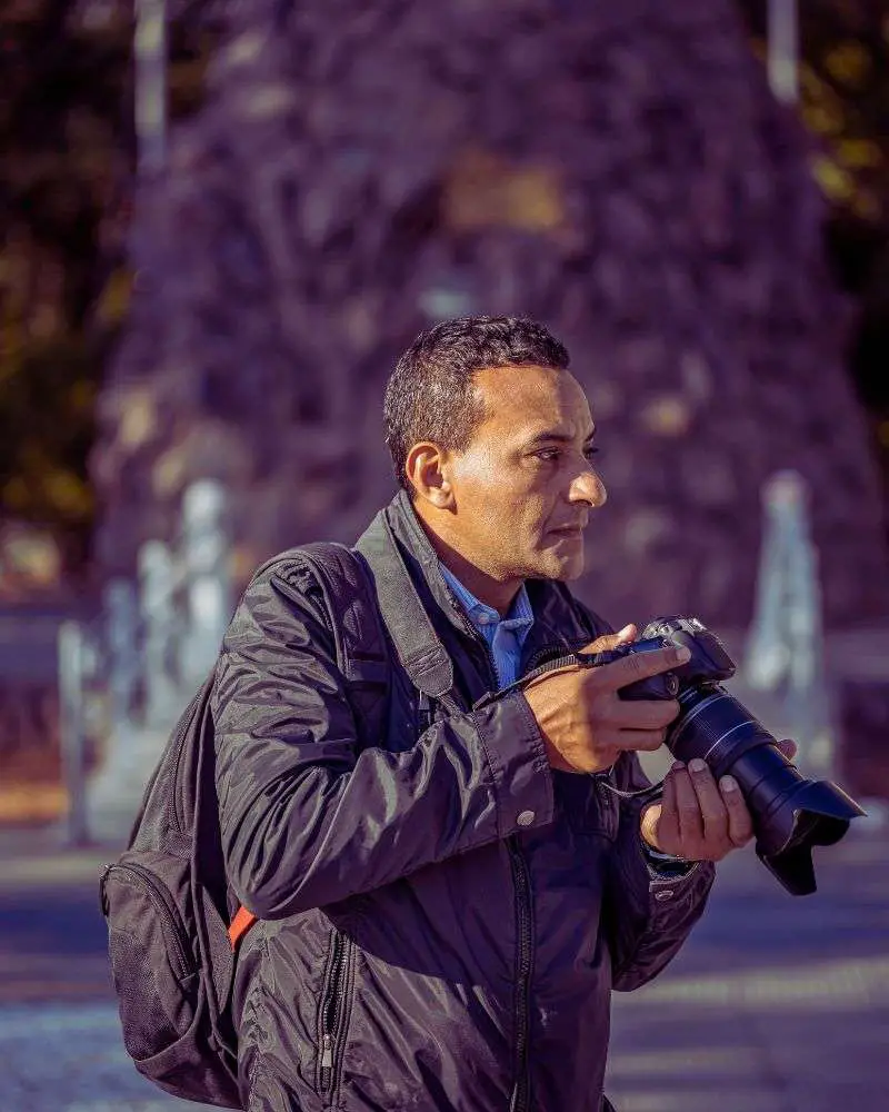 a man holding a camera 