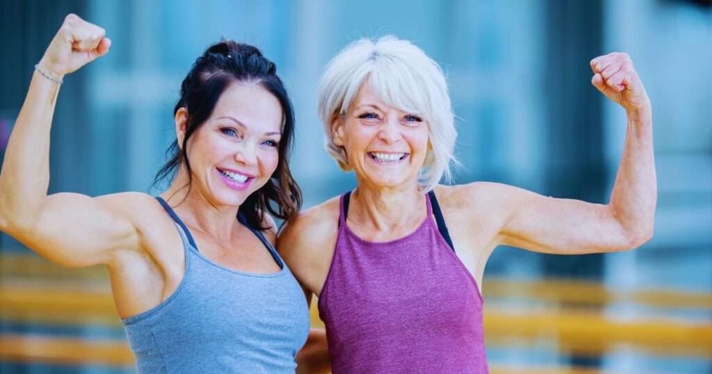 two women smiling at the camera doing safe 5x5 workout for over 50 women