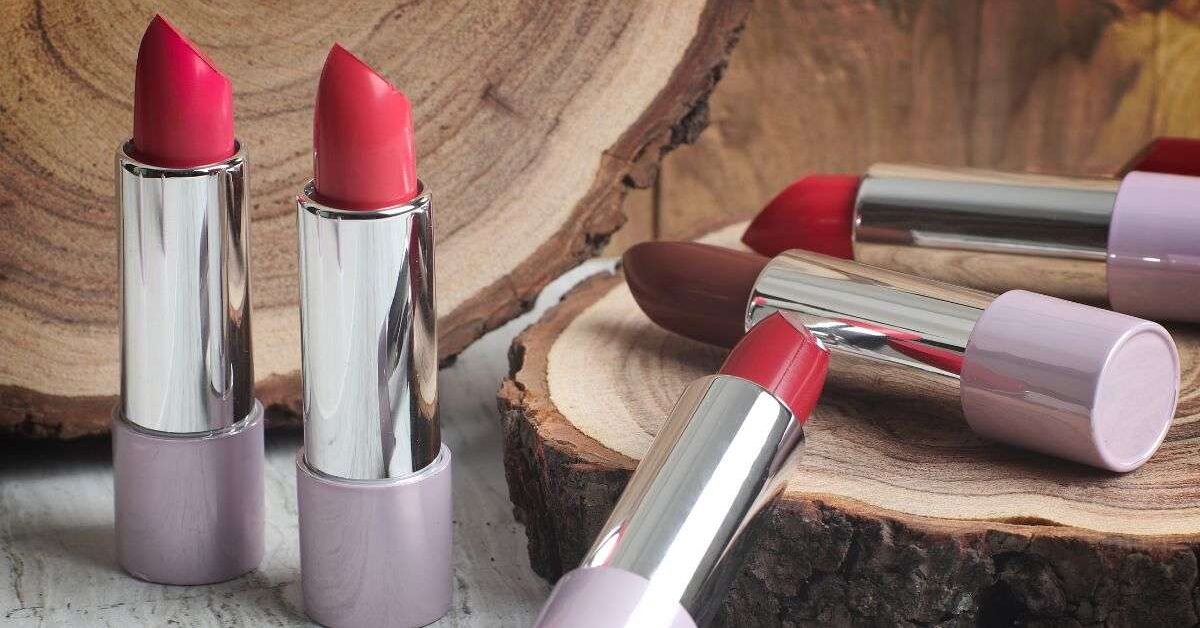 a group of lipsticks on a wood surface