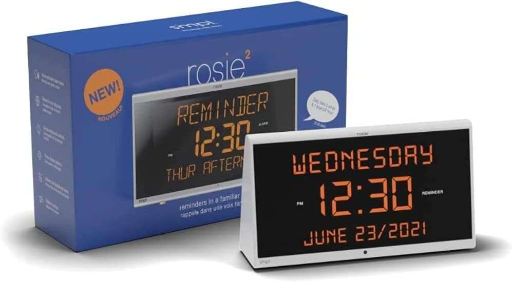 a digital clock next to a box