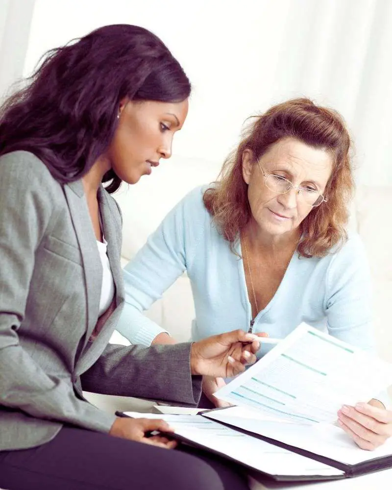 a woman looking at a paper