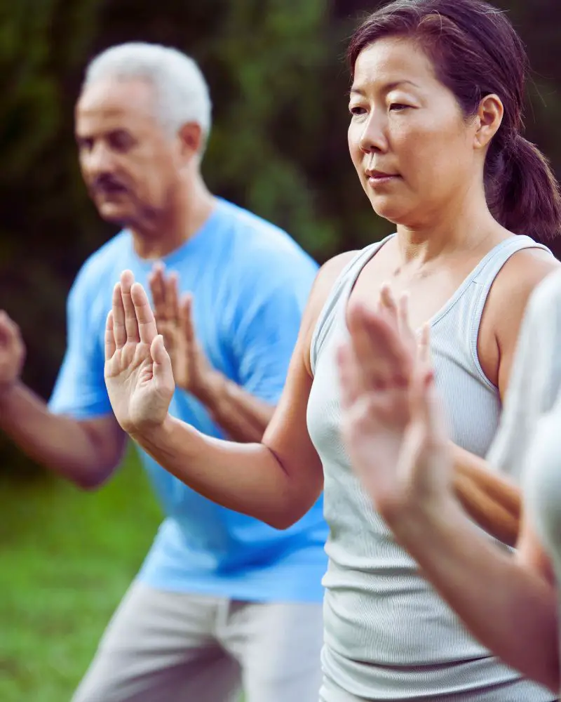 a group of people doing tai chi after discovering martial arts for people over 50