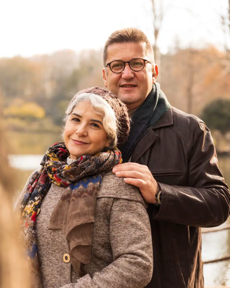 a man and woman standing together who have learned how to overcome nerves on a first date over 50