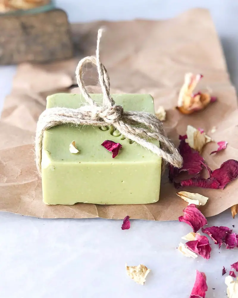 a green bar of soap tied with a string is beautiful but people making this type of soap should be aware of selling handmade soap regulations