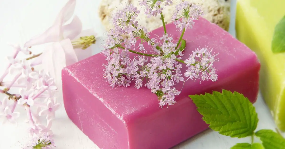 a pink soap with flowers on it