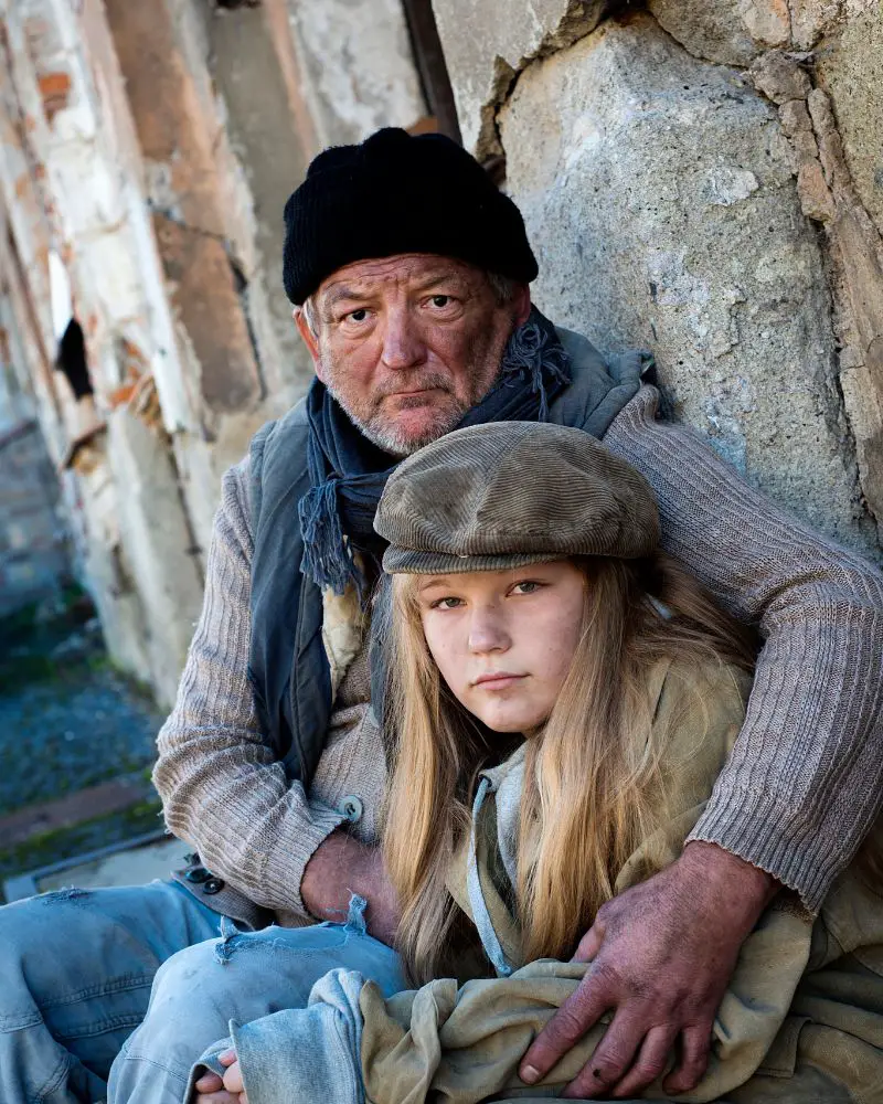 a man and a girl sitting together