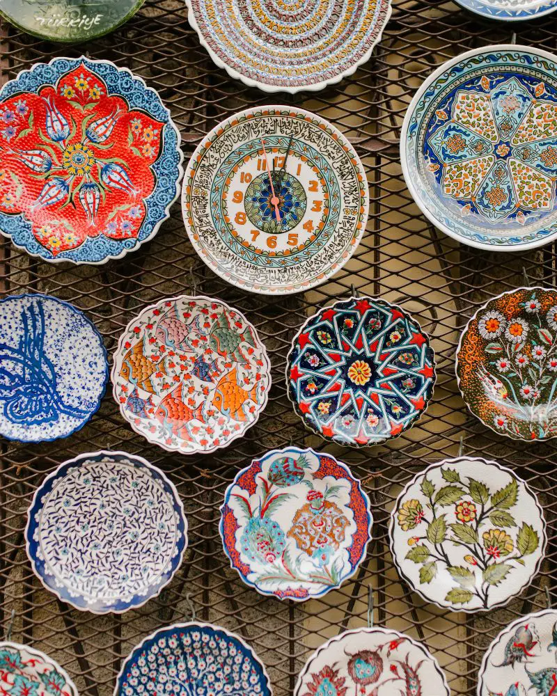 a group of colorful plates someone made after discovering a few cool pottery ideas