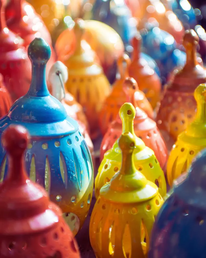 a group of colorful sculptural pottery 