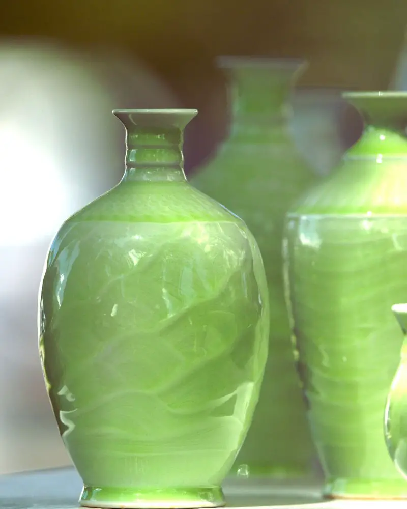 a group of green pottery vases that could be interesting to someone who wants to know how to tell if pottery is valuable