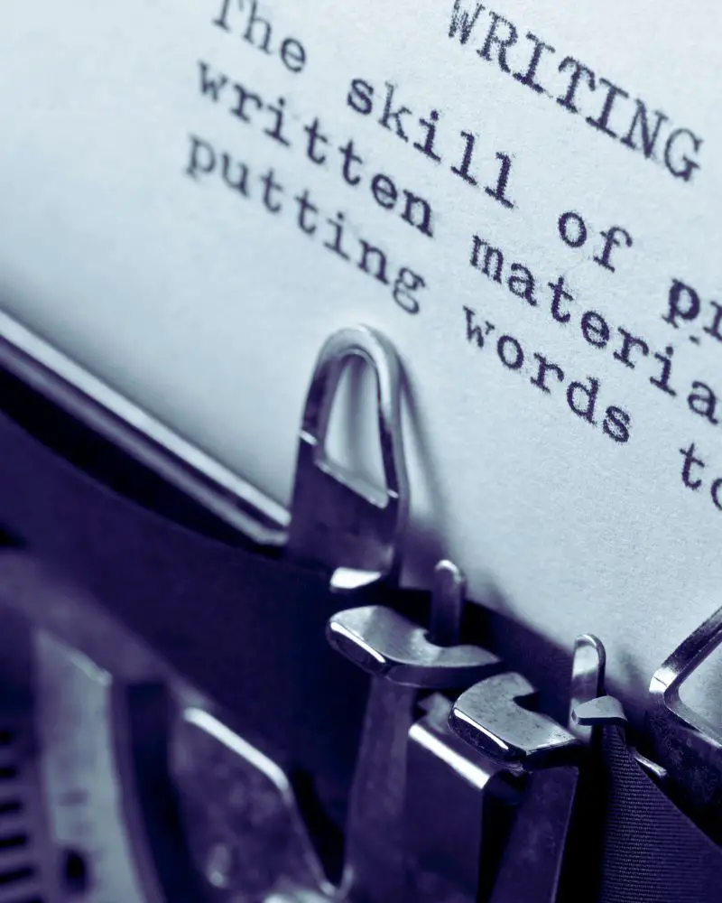 a close-up of a typewriter with writing on it that could have been generated with OpenAI tools in modern day