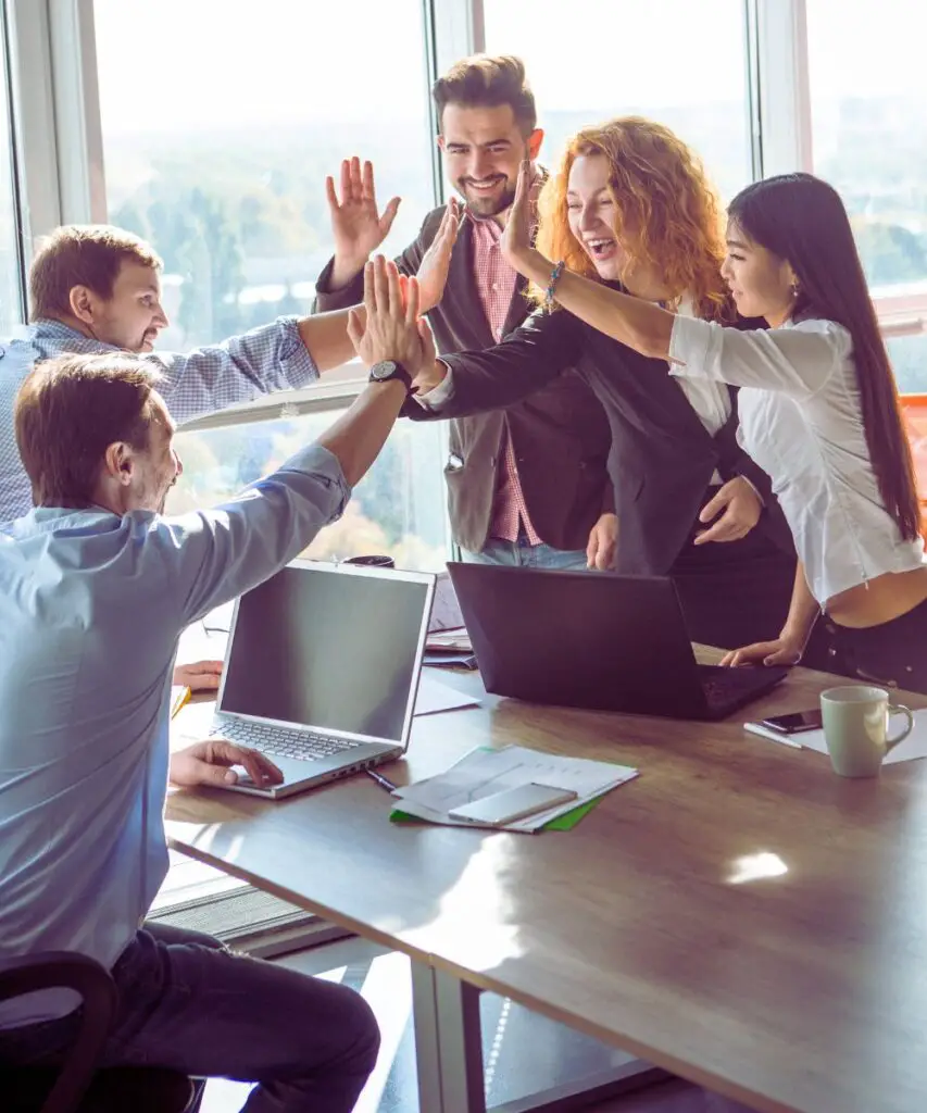 a group of people giving each other a high five after asking the question can we collaborate in canva