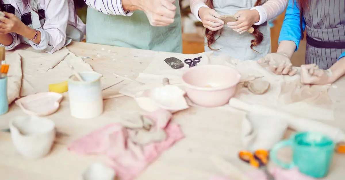 a group of people working on a craft