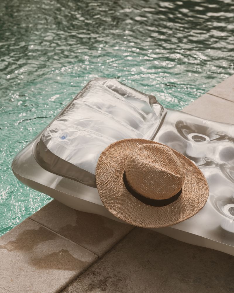 a pool float with a hat on it