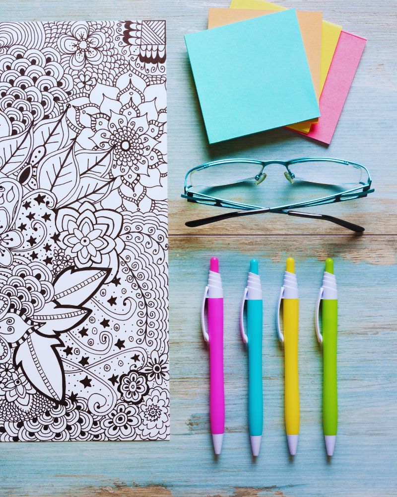 a coloring book and glasses to complement adult-geometric-coloring-pages