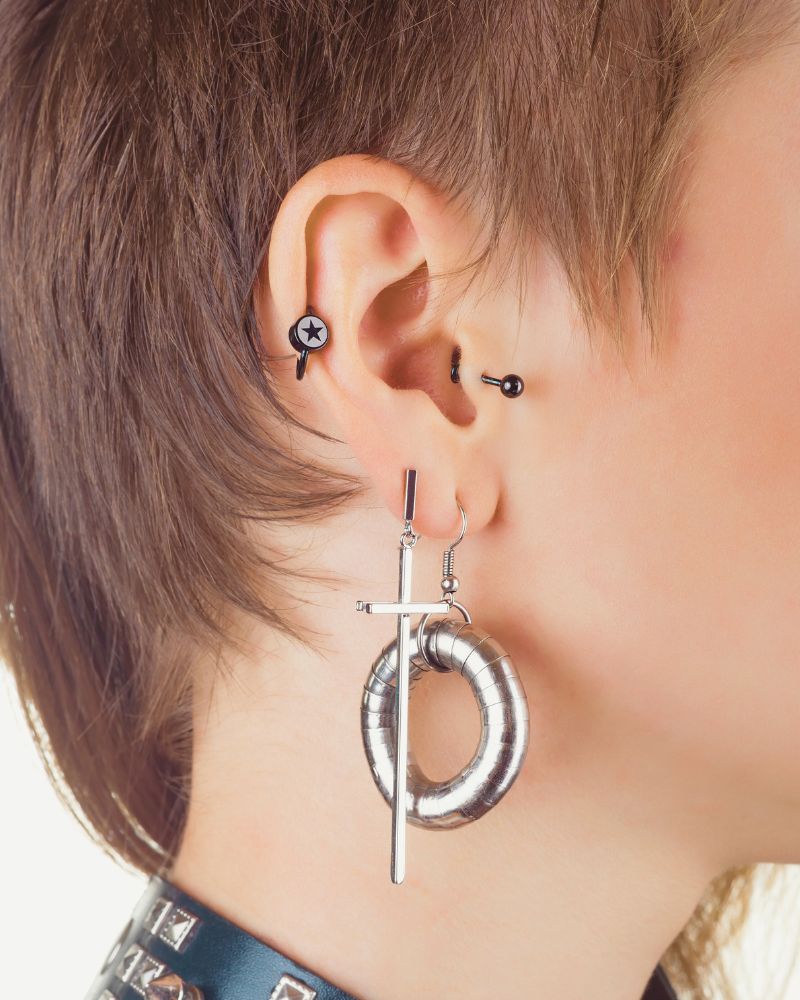 a person with multiple ear piercings to demonstrate the options available for ear piercing over 50