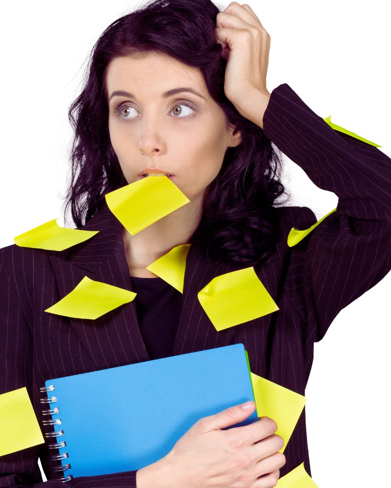 a woman with many yellow sticky notes on her face