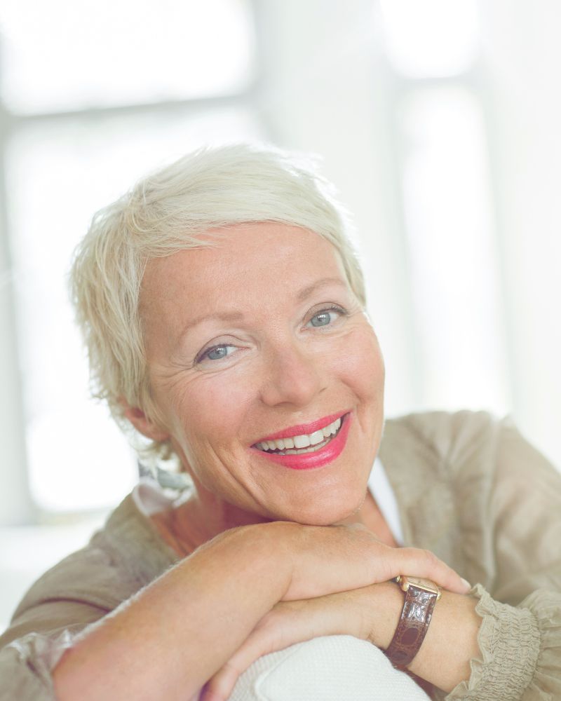 a woman with her arms crossed after making an appointment for a spray tan and learning about the best body wash before spray tan