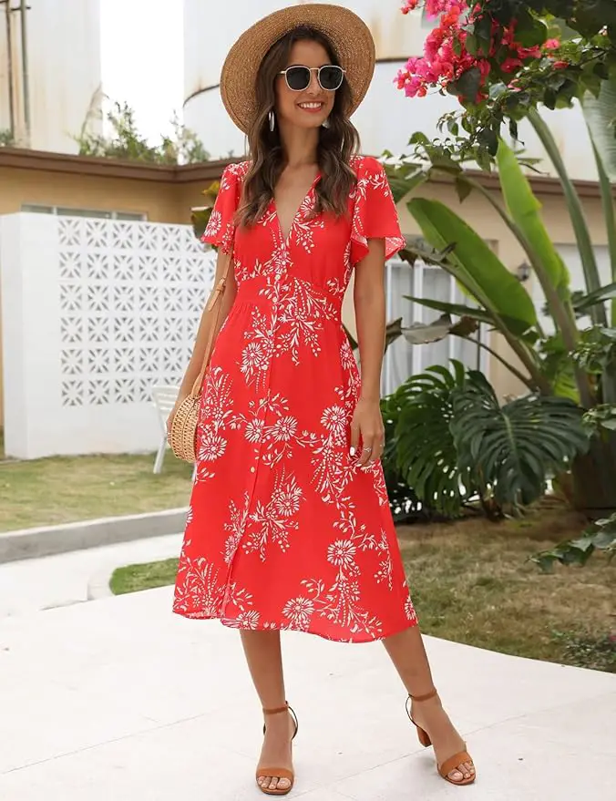 a woman in a red dress and hat