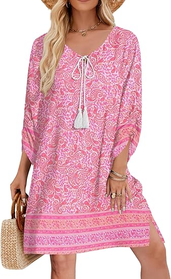 a woman in a pink dress rocking the boho style over 50 trend