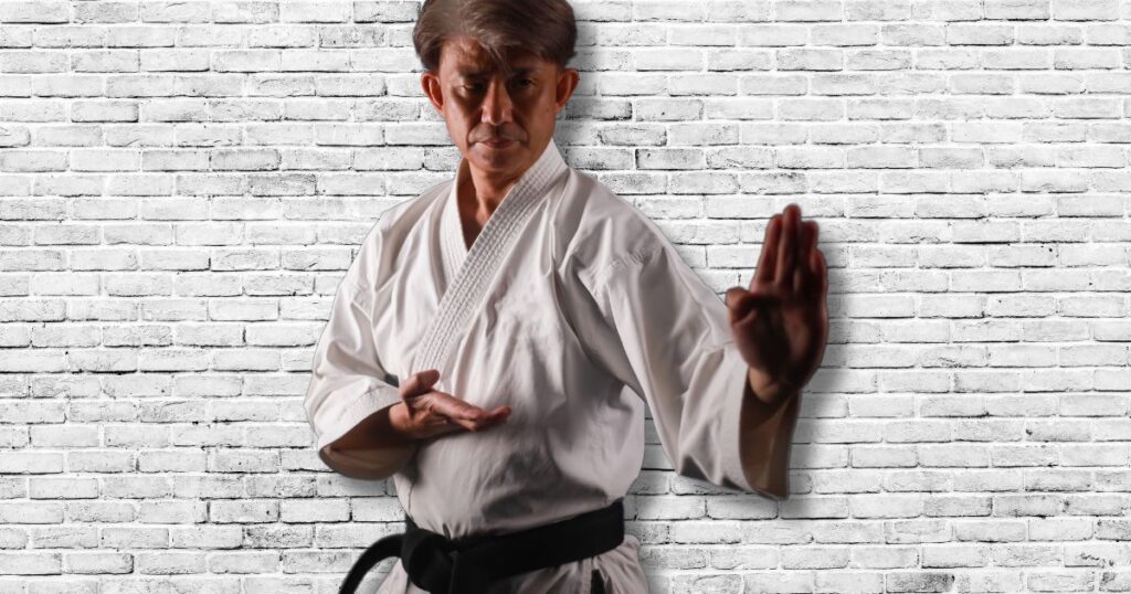 a man in a white kimono exploring the best martial arts for seniors